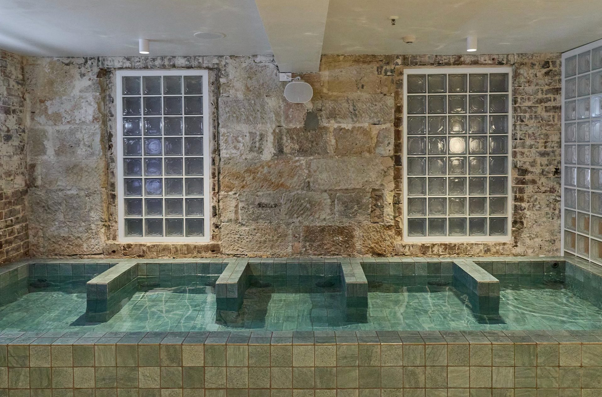 Green tiled built-in hot and cold plunges at 1Remedy, Potts Point